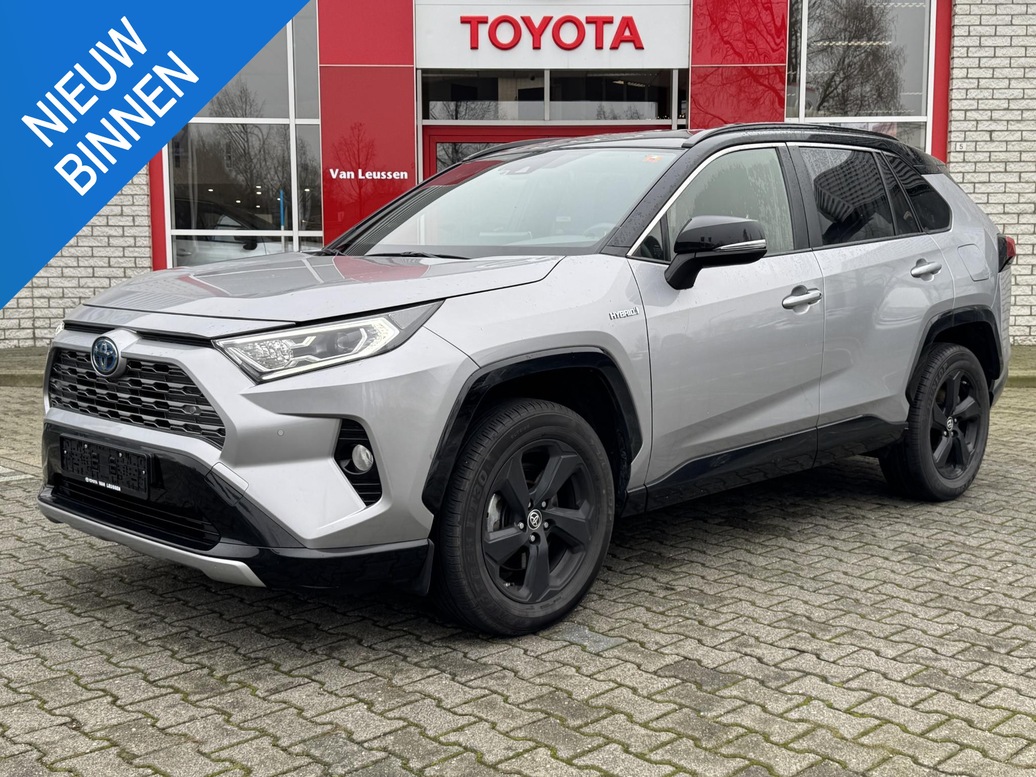 Toyota RAV4 2.5 HYBRID AWD BI-TONE STOELVERW NAVI PARK-SENSOREN JBL-AUDIO EL-ACHTERKLEP 18" LM-VELGEN CLIMA AD-CRUISE