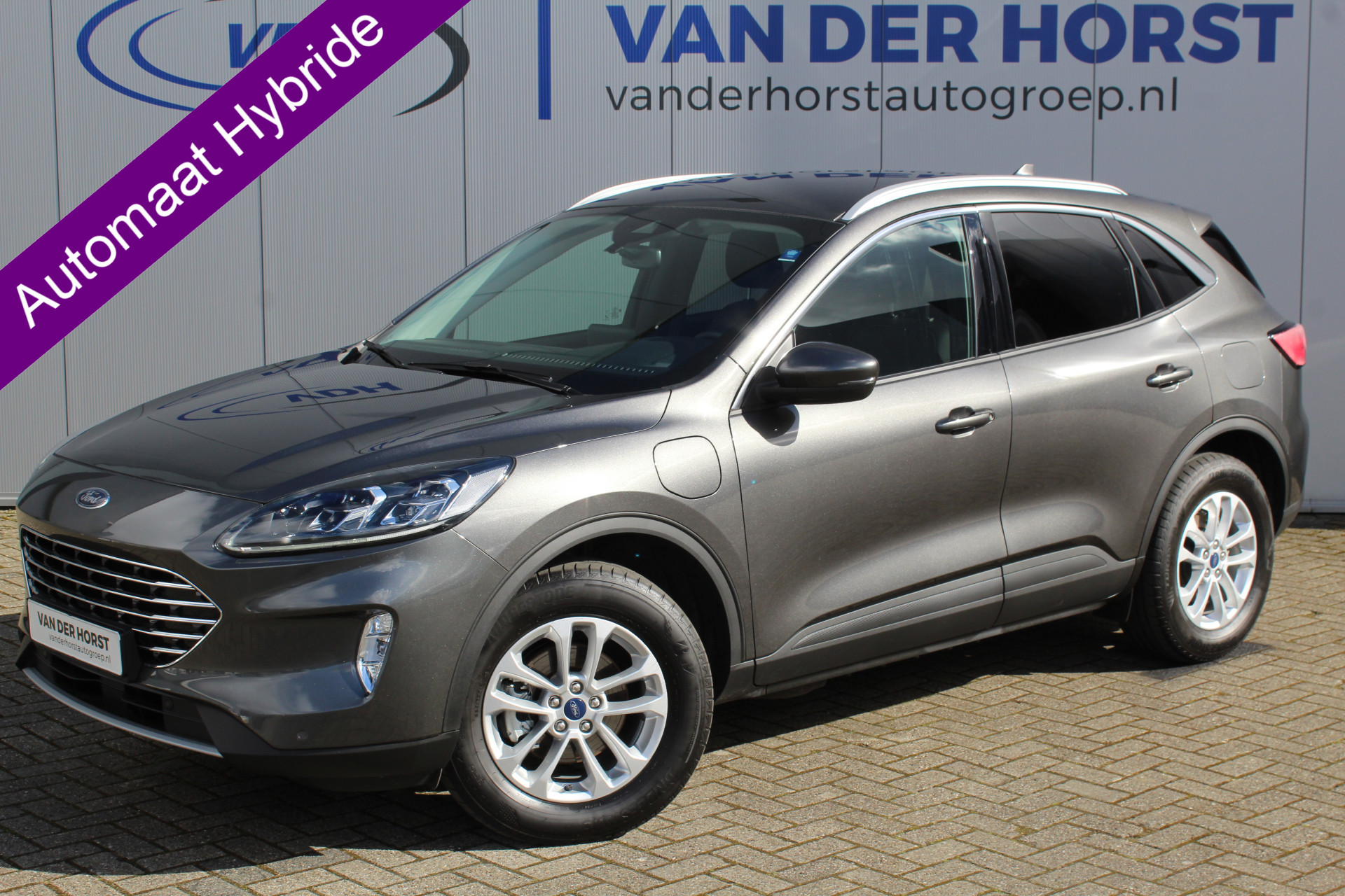 Ford Kuga 2.5-225pk PHEV Titanium X Plug-In Hybrid. Fabr. garantie t/m 07-04-2028 ! Slechts 10.000km ! Autm. airco dual, stoel-, stuur- en voorraamverw., LED verl., B&O soundsyst., metallic lak, cruise control, camera, LM wielen, elektr. achterklep en best. stoel etc.