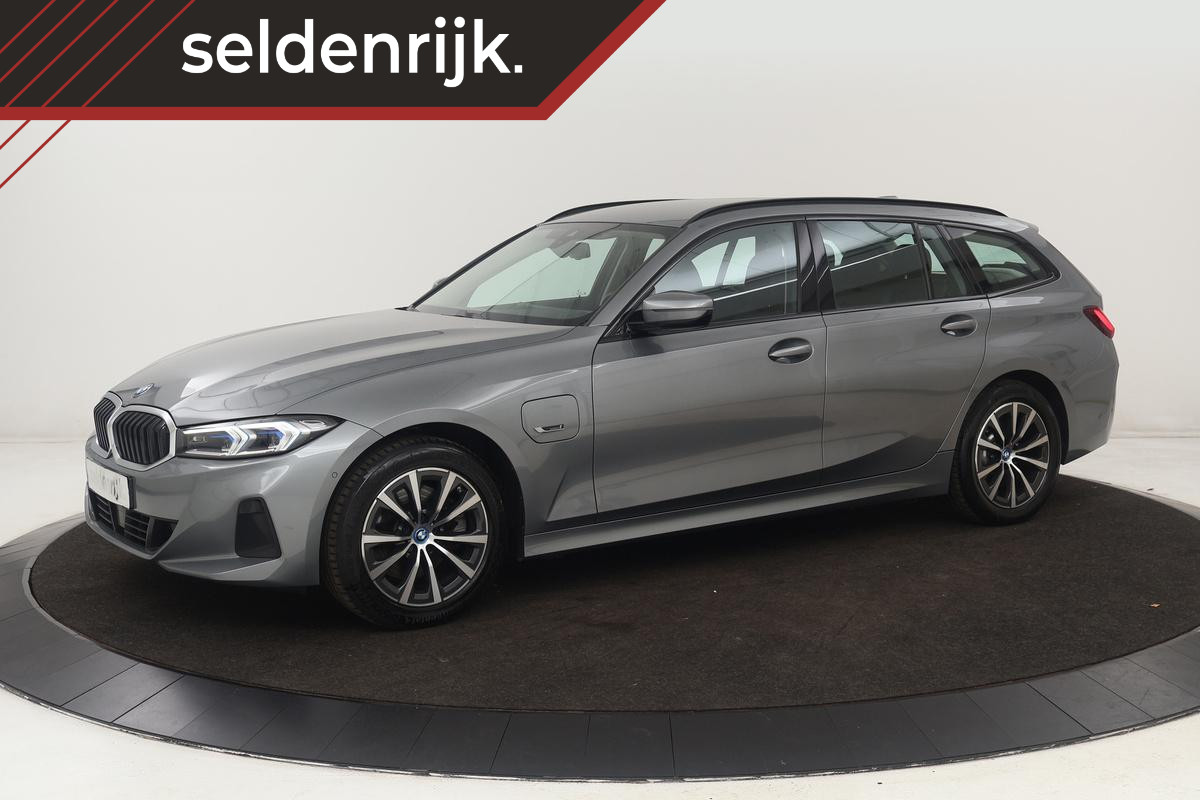 BMW 3 Serie 320e Business | Stoelverwarming | Adaptive cruise | Trekhaak | Harman/Kardon | Carplay | Camera | Half leder | Sportstoelen